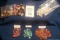 Overview of assorted beads in small plastic bags and sorted by type with labels