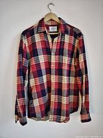Full front view of the Portuguese Flannel shirt showing check pattern and buttons.