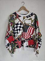 Front view full sweatshirt showing the multicolor flag pattern with ropes.