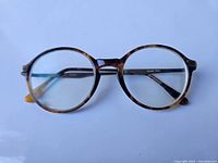 Front view of round tortoiseshell Ralph Lauren eyeglasses showing lens and frame detail.