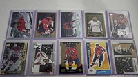 Top view of 10 Alex Ovechkin hockey cards arranged in two rows, including various card brands and designs.
