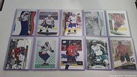 10 Alex Ovechkin hockey cards laid out in two rows on a flat surface.