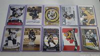 Full view of 10 Sidney Crosby hockey cards laid out to show front artwork and designs