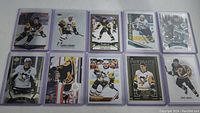 Ten Sidney Crosby hockey cards in two rows, many in protective sleeves.