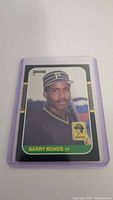 Photo of Barry Bonds rookie baseball card in protective sleeve showing front side with Donruss logo and Pirates logo.