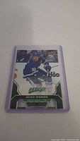 Photo of Mitch Marner MVP hockey trading card in plastic sleeve showing player in Toronto Maple Leafs uniform.