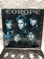 Front cover of Europe 'Out of This World' album with blue toned band photo.