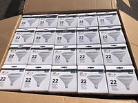 Box containing 25 boxes of 100W equivalent LED bulbs arranged neatly showing front of packaging with label and specs