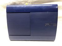Top view of the blue PlayStation 3 console showing ribbed design and PS3 logo.