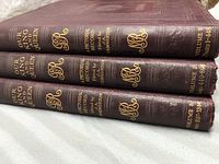 Three stacked vintage hardcover books titled 'Our King and Queen.' Spine shows volume and page ranges with gold embossed text.