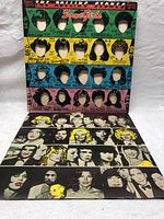 Front colorful cover with faceless female figures and hairstyles in pop-art style.