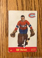 Front of 1955-56 Parkhurst #63 Bill Durnan hockey card showing player image and details.