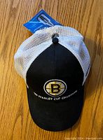 Photo of the front of the hat showing embroidered Boston Bruins logo and text.