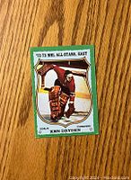 Front of 1973-74 Topps Ken Dryden hockey card showing player image and team info.