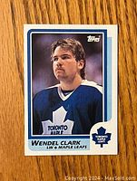 Front side of the 1986-87 Topps Wendel Clark rookie hockey card showing player portrait in Toronto Maple Leafs jersey.