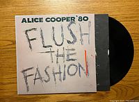 Front cover of Alice Cooper '80 Flush The Fashion vinyl record album showing title and artist text.