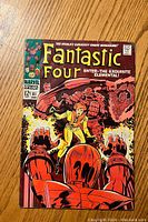 Front cover of Fantastic Four #81 comic showing characters and title with vintage style and colors.