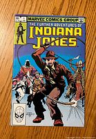 Front cover photo displaying The Further Adventures of Indiana Jones #1 comic book with vibrant cover art depicting Indiana Jones and samurai characters.