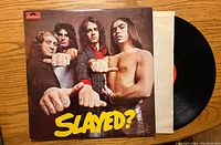 Front cover of Slade 'Slayed?' vinyl record album showing band members and title.