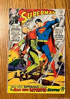 Front cover of Superman comic #205 showing Superman and antagonist, with iconic logos and vintage comic styling.