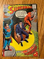 Front cover of Superman comic book issue #211 showing characters and title.