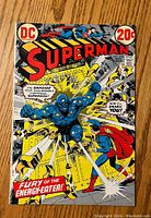 Front cover of Superman #258 comic showing colorful fight scene between Superman and a blue energy creature with speech bubbles providing story context.