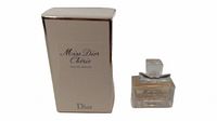 Image showing the Miss Dior Cherie Eau De Parfum 5ml perfume bottle next to its beige box with black text.