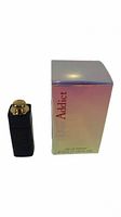 Photo of Dior Addict 5ml miniature perfume bottle beside its box on white background