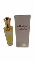 Photo showing vintage Madame Rochas Eau De Toilette bottle with gold cap and original cream box with text.
