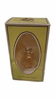 Front view of yellow box containing 0.2 oz vintage Nina Ricci L'Air du Temps perfume bottle by Lalique, showing oval window and condition of box.