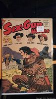 Front cover of the 1958 Six Gun Heroes comic book showing characters and western imagery.