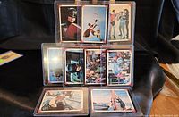 Set of 9 Batman 1966 cards arranged in a display with images showing Batman, Robin, Batgirl, Riddler, and Batmobile