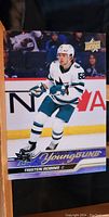 Front of the Tristen Robins Young Guns rookie card showing action pose in San Jose Sharks jersey.
