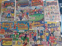 Top view of ten Archie comic books featuring Betty and Veronica on colorful covers