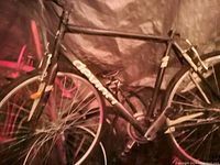 Overall view of black Giant bicycle showing frame, wheel, drivetrain and brake setup