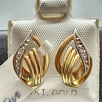 Front view of earrings mounted on display holder