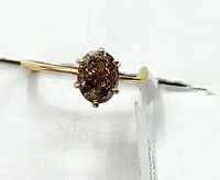 Oval brown diamond solitaire ring in 10k gold prong setting