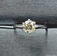 Top view of ring showing round brilliant diamond in six-prong setting