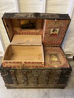 Trunk open showing interior lining and removable wooden box