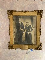 Full front view of the framed wedding couple photo with plaque