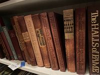 Shelf showing 9 leatherbound American history and Civil War themed books with embossed titles and large format sizing.