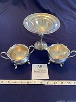 Full view of sterling pedestal candy dish with matching creamer and sugar set, alongside ruler showing approximate size.