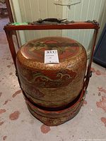 Assembled set of frame and stacked lacquered boxes