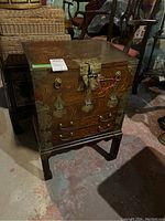 Front view showing overall structure and brass hardware