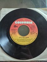 Side B vinyl record label showing song "Together Again" by Chicago on Columbia label from 1976.