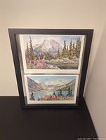 Frontal image of the framed watercolor paintings showing Heart Mountain on top and Lake Louise on bottom.