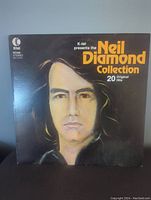 Front cover of vinyl record sleeve showing an illustrated portrait of Neil Diamond with title 'K-tel presents the Neil Diamond Collection 20 Original Hits'.