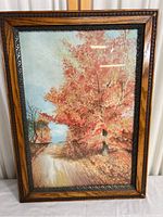 Full view of the framed autumn tree and trail print showing the colorful scene and ornate frame.
