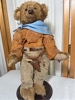 Front view of the John Wayne themed teddy bear showing full body, outfit, and facial details.