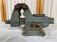 Front side of the Wilton vise showing rust and fixed jaws
